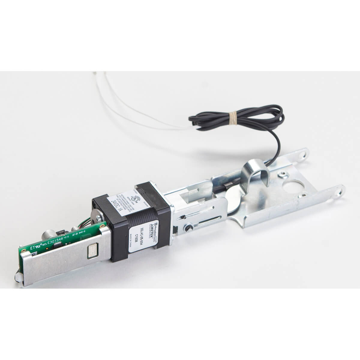 Metallic door latch mechanism with black wire attached.
