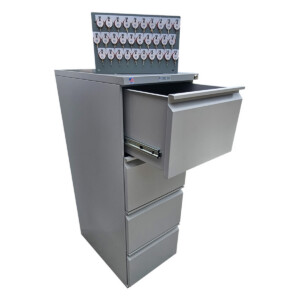 Cabinet with open drawer and hanging labeled keys.