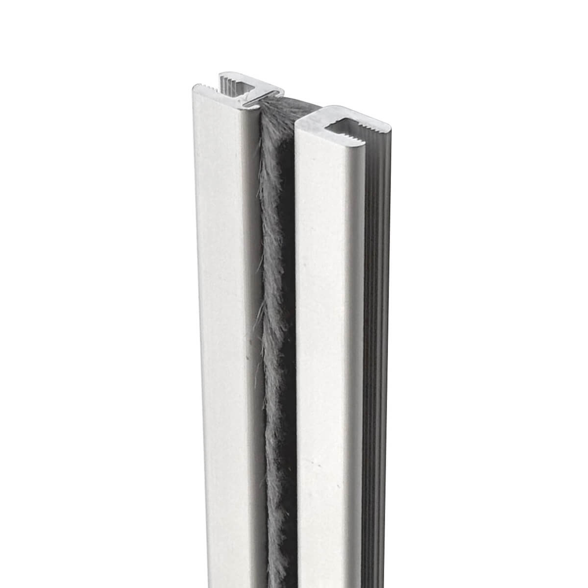 Aluminum weatherstrip with brush seal, vertical orientation.
