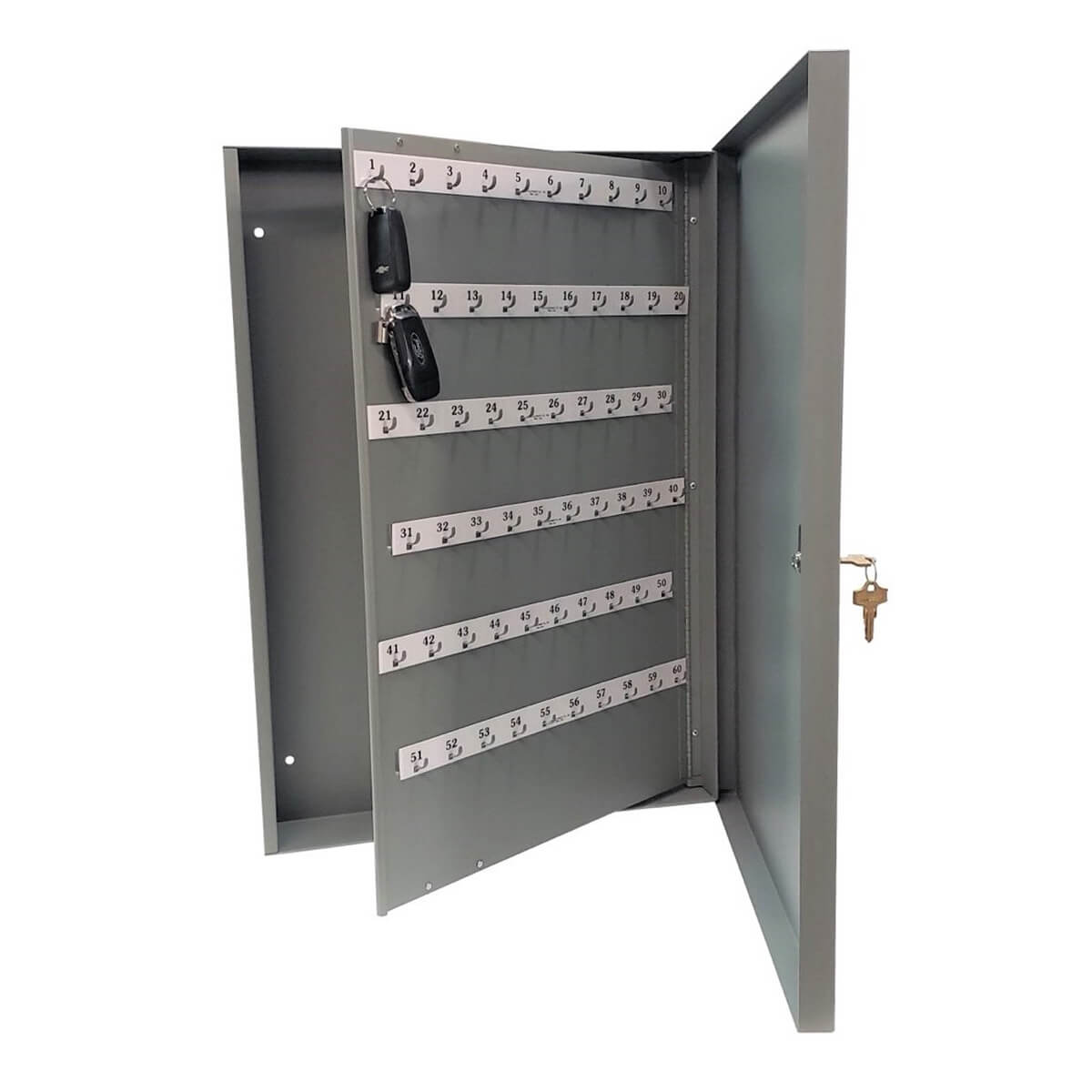 Open key cabinet with keys hanging inside.